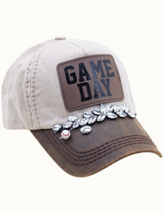 Cap with 'GAME DAY' patch and decorative elements on a white background