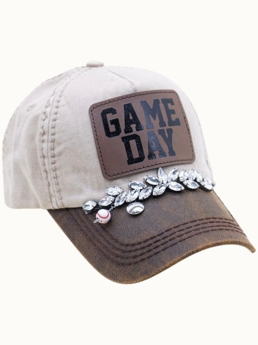 Cap with 'GAME DAY' patch and decorative elements on a white background