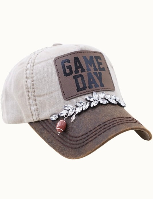 Cap with 'Game Day' patch and decorative elements on a white background