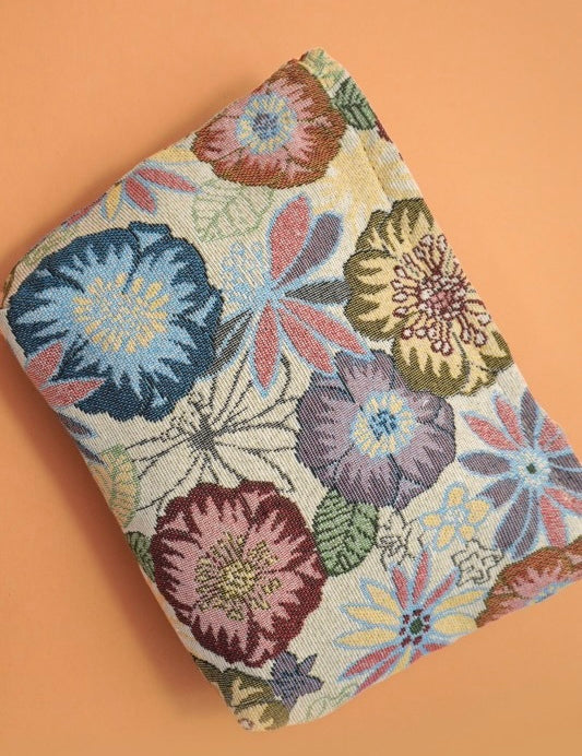 Floral patterned pouch on a peach background