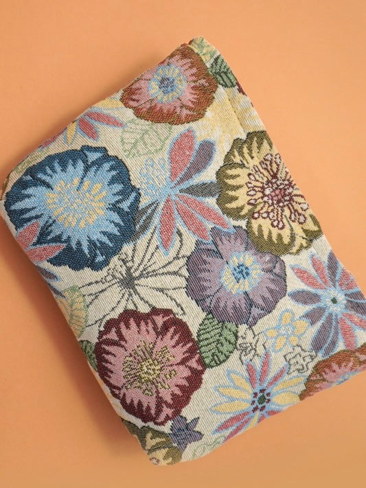 Floral patterned pouch on a peach background