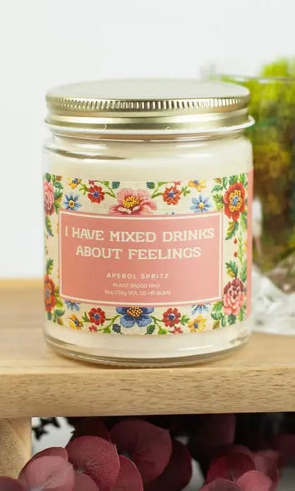 Jar with floral label and text on a wooden surface