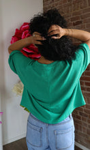 Back of a crewneck green top