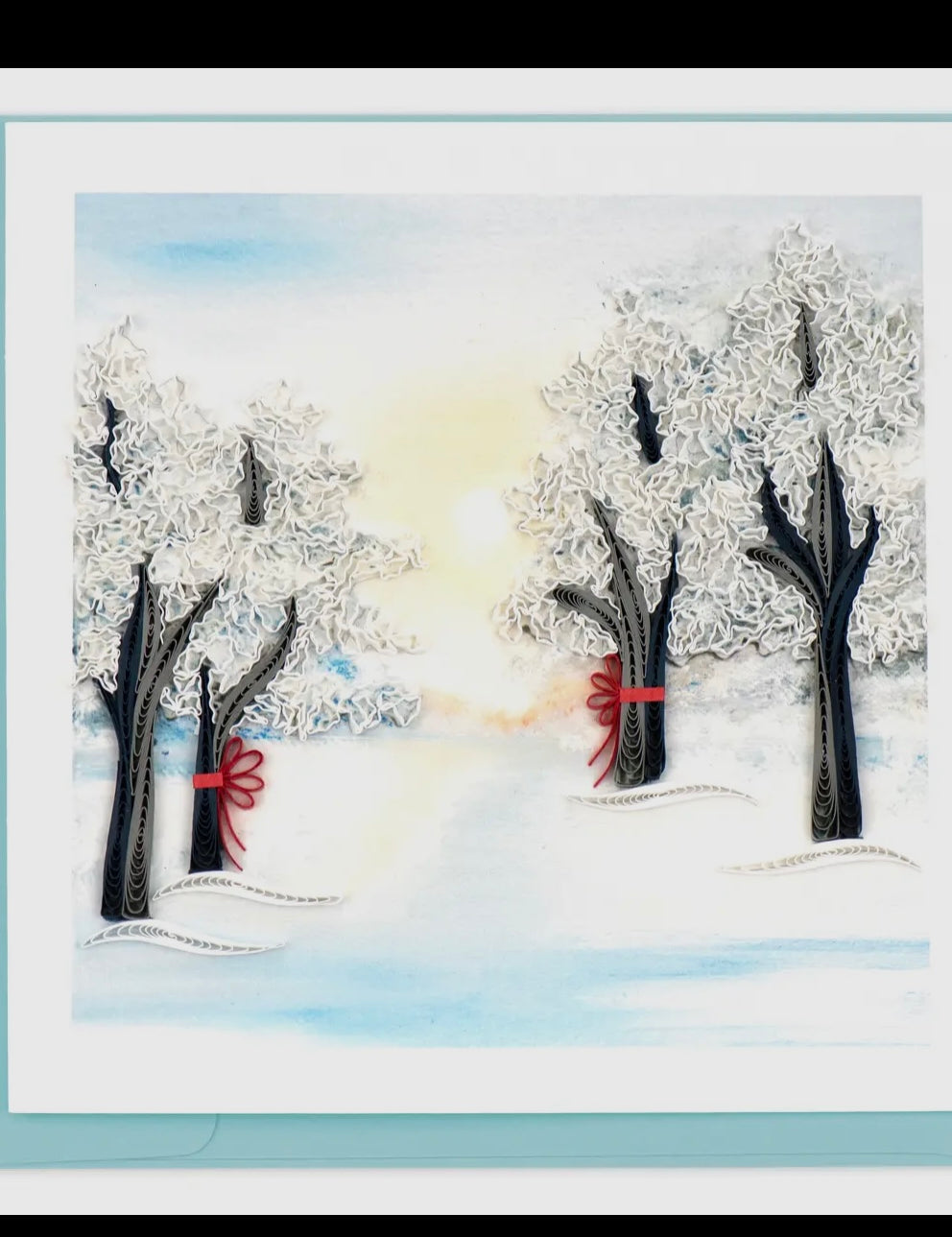 Winter scene with trees and snow, featuring a red object in the snow.