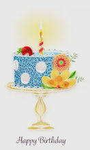 Decorative birthday cake with flowers and a candle on a white background