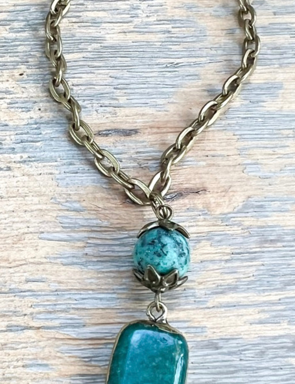 Necklace with turquoise beads on a textured surface