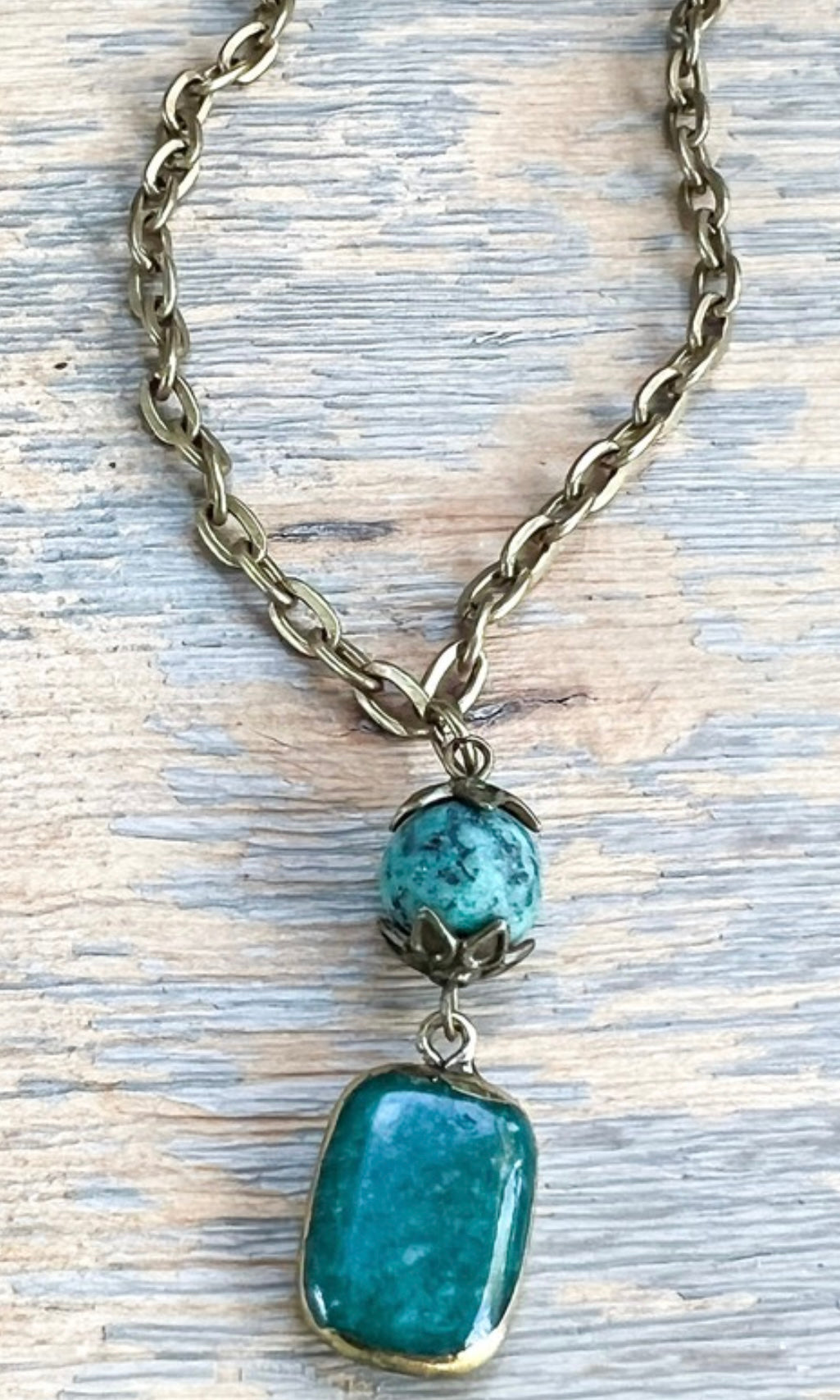 Necklace with turquoise beads on a textured surface