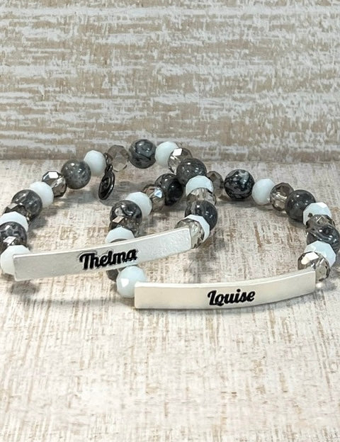 Bracelet with engraved names on a textured surface