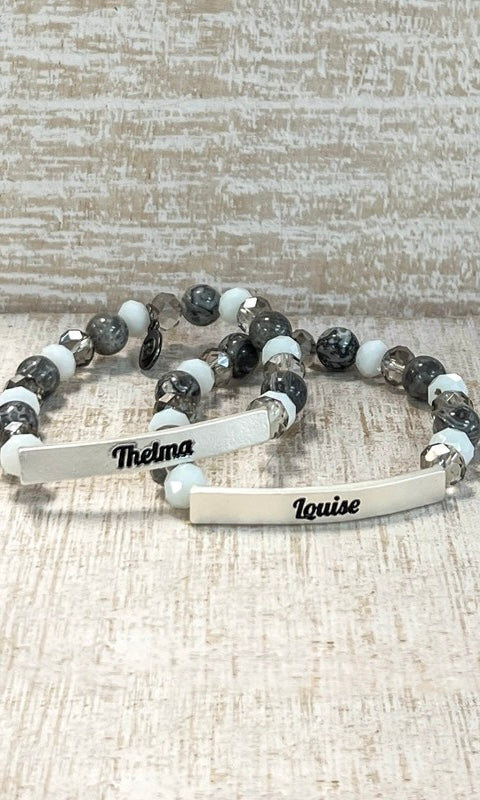 Bracelet with engraved names on a textured surface