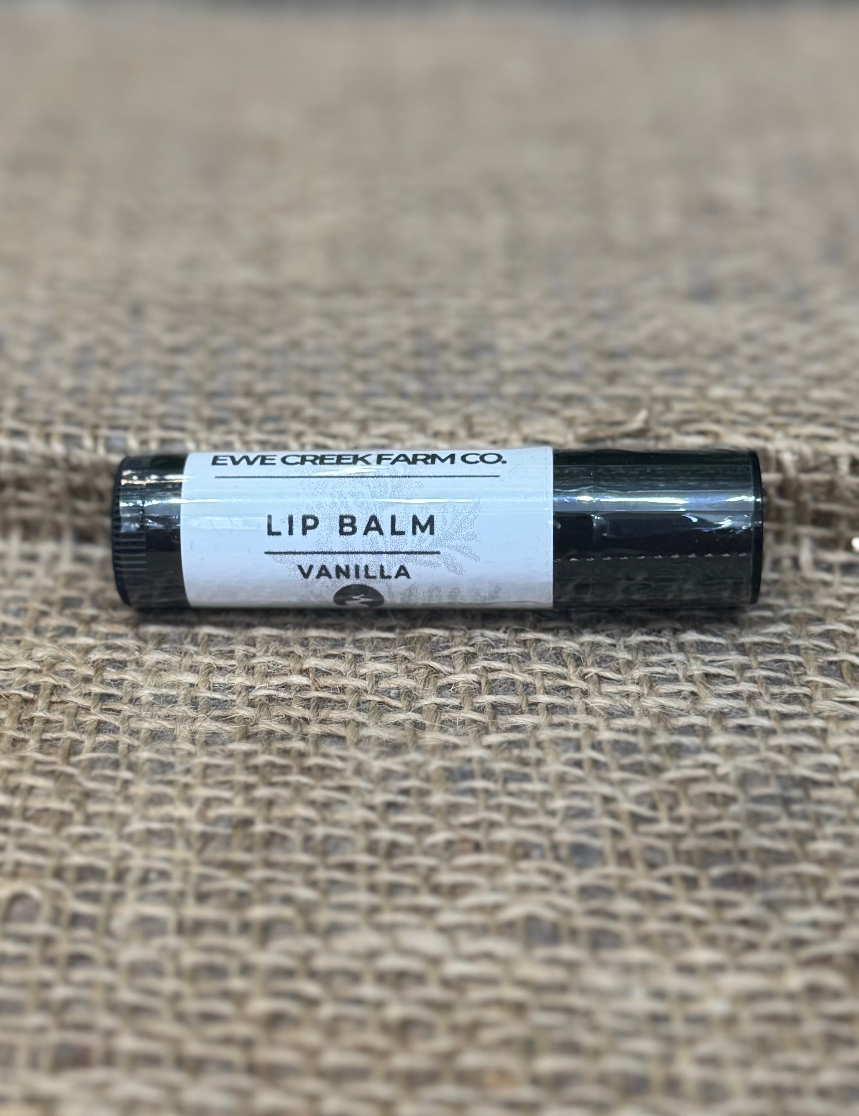 Lip balm with a label on a textured surface