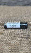 Lip balm with a label on a textured surface
