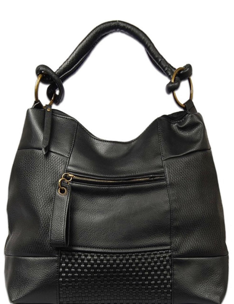 Black vegan leather shoulder handbag with antique gold hardware, a zip top closure, and an adjustable shoulder strap.